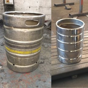 A polished metal beer keg