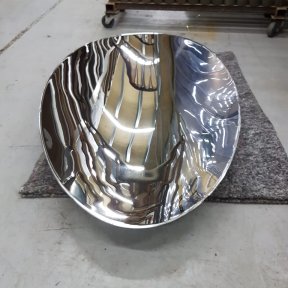 A polished metal bowl