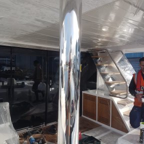 Polished metal on yacht.  Mirror finish